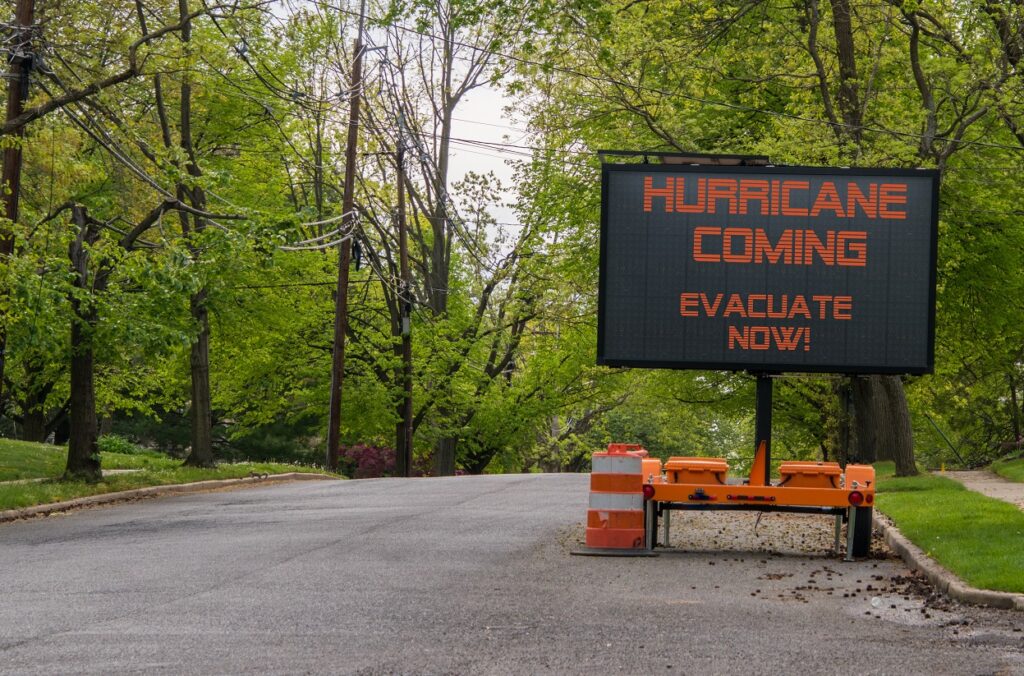 a road sign reading hurricane coming