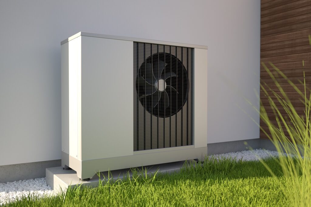 a heat pump behind a home